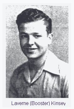 A black and white photo of a man in a shirt.