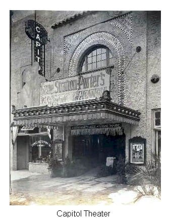 A black and white photo of the front entrance to a theater.