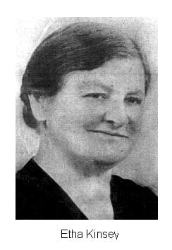 A black and white photo of an older woman.