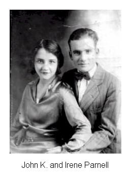 A man and woman pose for the camera.