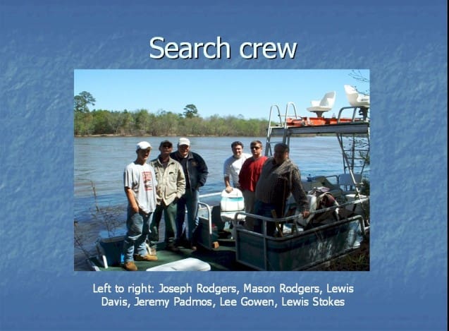 A group of people on a boat in the water.